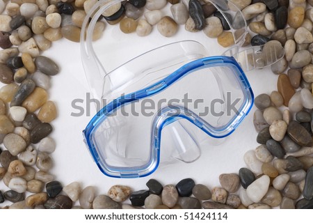 Stones frame with diving mask; concept: summer time!