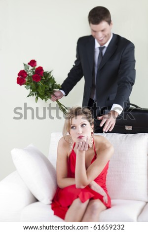 Disappointed woman unsuspecting her husband surprise