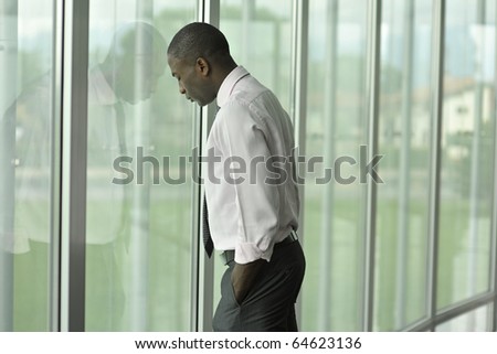Businessman in his office, looking depressed