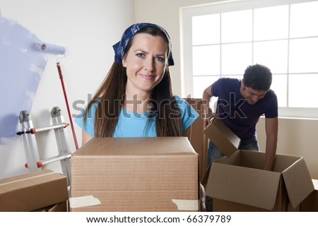 Young couple unpacking on their moving day