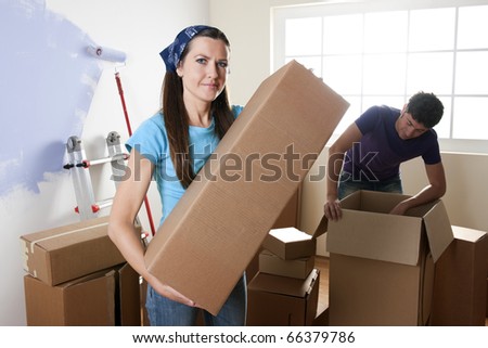 Young couple unpacking on their moving day