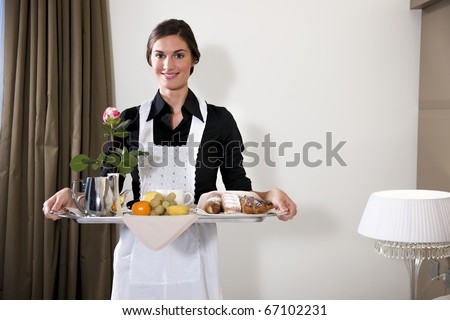 Happy Maid Carrying Breakfast Tray