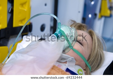 Unconscious Woman With Oxygen Mask, ambulance interior