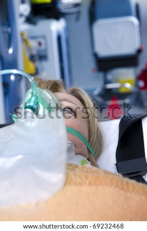 Injured Woman With Oxygen Mask, ambulance interior