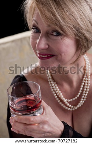 Happy Mature Woman With Drink