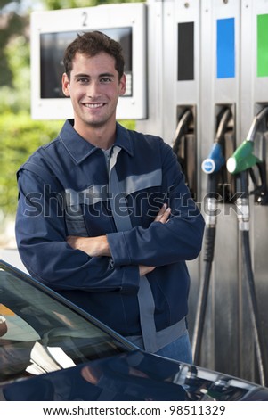 Portrait of a young service station worker smiling at camera