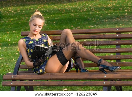 Pinup girl with book
