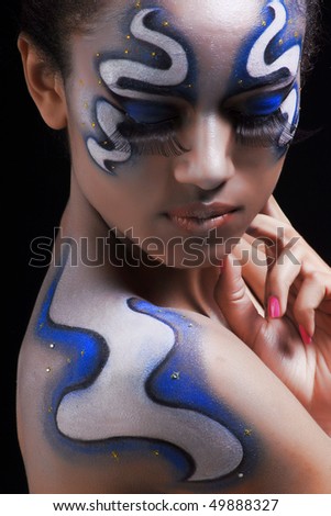 Portrait of mulatto girl with space face-art, body-art