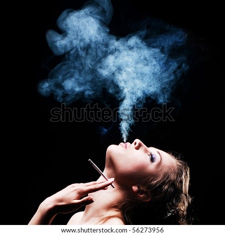 woman smokes in the dark