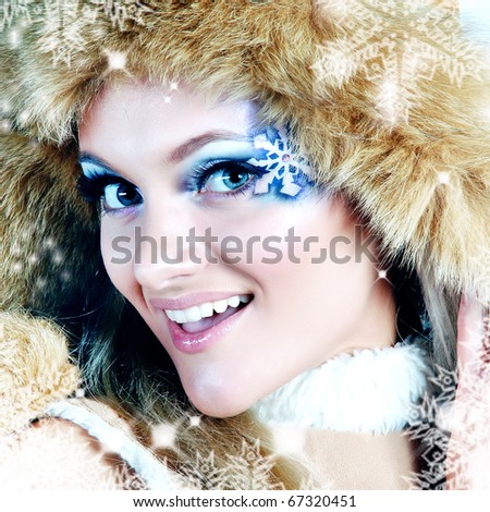laughing woman framed by snowflakes
