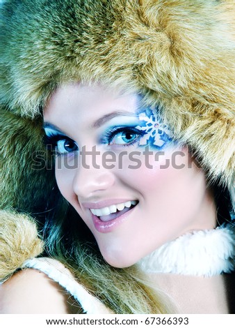 laughing woman framed by snowflakes