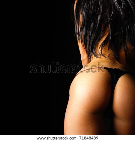 stock photo Beautiful ass of young woman over dark background