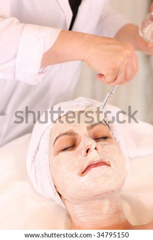 Facial treatment being applied in beauty clinic.