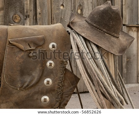 Nicely worn and distressed leather Western cowboy wear.