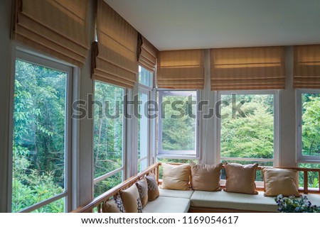 brown roman blind shade curtain tree forest mountain background living room