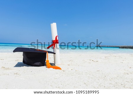Graduation cap and certificated on the beach with beautiful sea in summer,Education in summer Concept