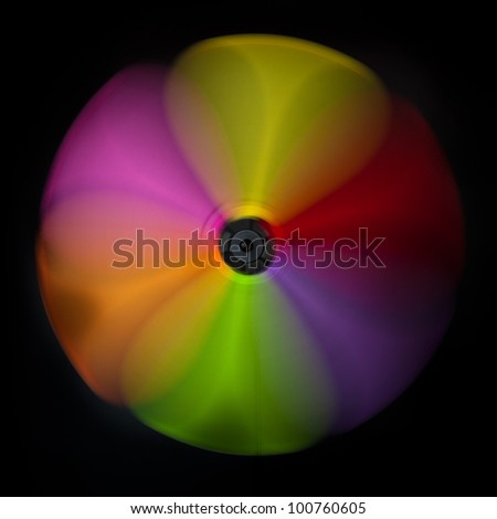 Colorful abstract windmill against a black background