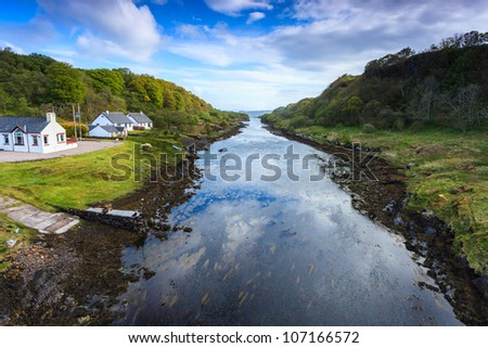 Houses near the river in a mountain landscape