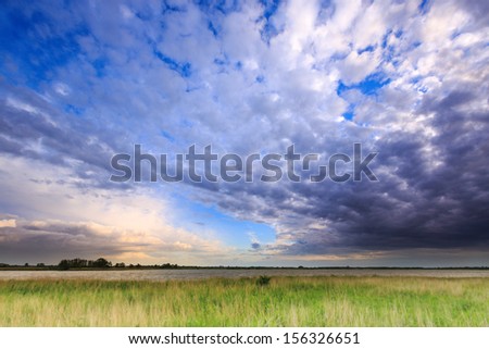 Dark clouds above a lake in the evening