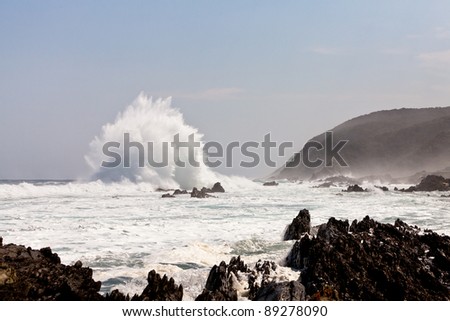 High wave breaking on the rocks of the coastline
