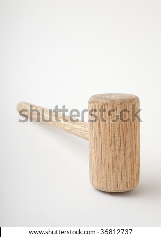 Wooden mallet lying on side