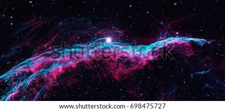 The Veil Nebula or The Witch\'s Broom Nebula is a cloud of heated and ionized gas and dust in the constellation Cygnus. Retouched colored image. Elements of this image furnished by NASA.