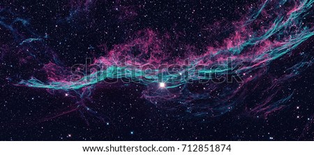 The Veil Nebula or The Witch\'s Broom Nebula is a cloud of heated and ionized gas and dust in the constellation Cygnus. Retouched colored image. Elements of this image furnished by NASA.