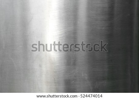 Stainless steel metal surface background or aluminum brushed silver metal texture with reflection.