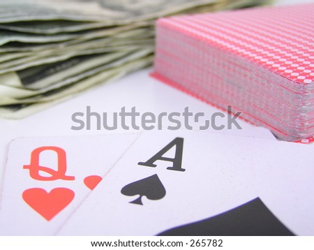blackjack with a queen of hearts and ace of spades.