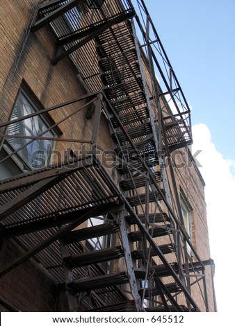 fire escape in the city with blue sky and clouds