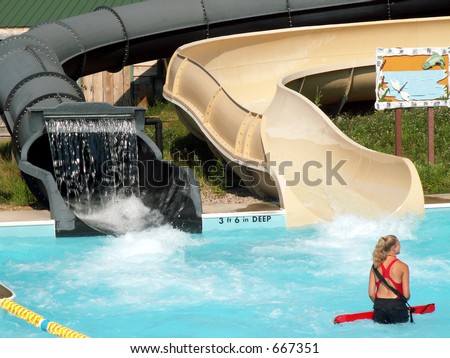 female lifeguard in pool at water park