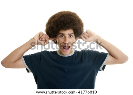 Mixed-race teenage boy with her fingers in his ears making noises
