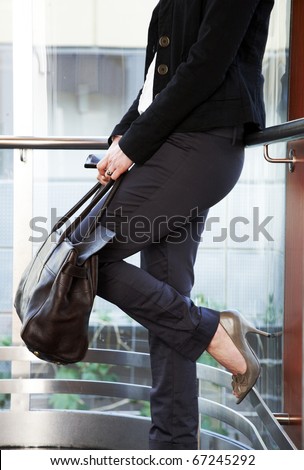 Business woman in fancy elevator