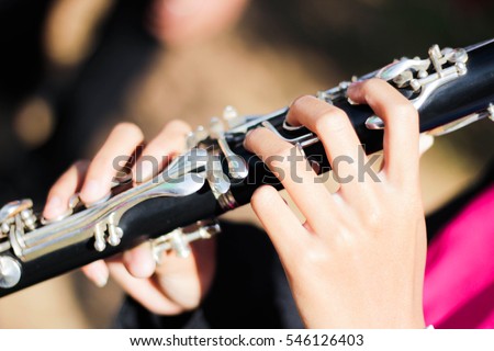 Music playing musical instrument in a marching band Clarinet.