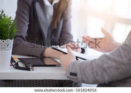 Young woman arriving for a job interview. Business people talking in modern office. colloquy dream job close up.