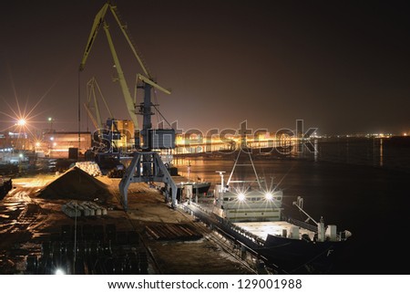 Night works in river port.