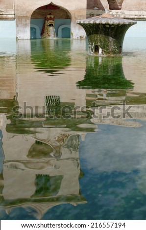 tower reflection on the ancient pool at taman sari water castle - the royal garden of sultanate of jogjakarta