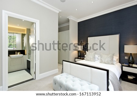 Luxurious hotel style double bedroom with king size bed, luxury designer furniture and private ensuite