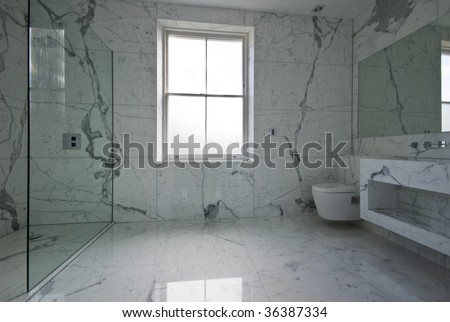 contemporary bathroom with natural stone tiles
