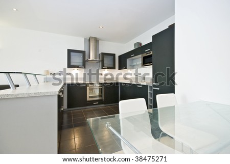 high spec dining area with open plan kitchen view