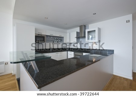 fully fitted modern kitchen in white with appliances