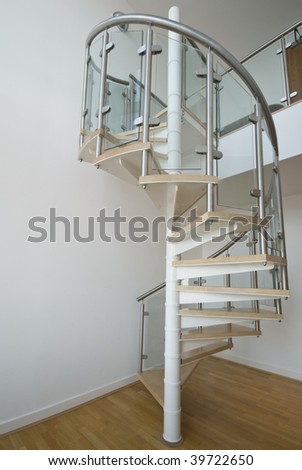 solid newel stairs with wooden steps and glass and steel rail