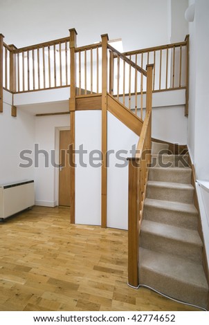 split level living room with staircase and study room