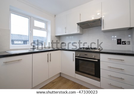 Modern fully fitted kitchen with appliances