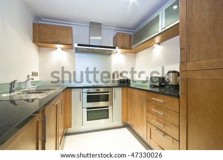 Modern fully fitted kitchen with appliances