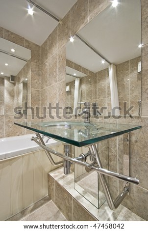 Luxurious Bathroom Detail With A Designer Glass Wash Basin And ...