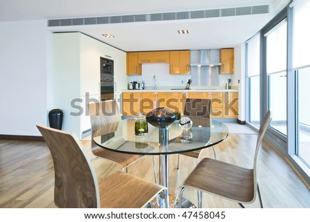Modern dining area with fully fitted kitchen