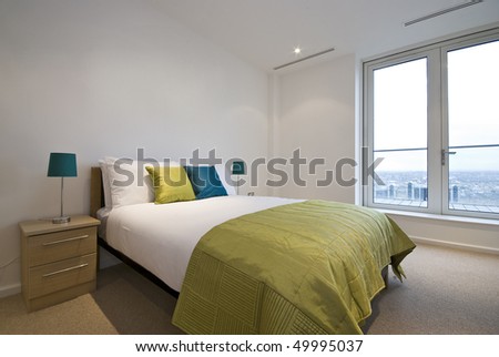 Modern double bedroom with king size bed and bedside tables