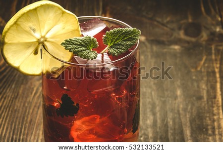 wooden background about red cocktail/red cocktail on a wooden background