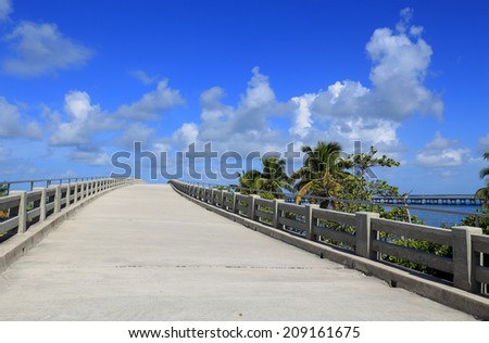 A concrete ramp, part of Florida\'s historic old Overseas Highway, appears to lead into the sky.